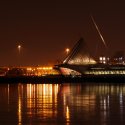 Orange lights reflect off of a Milwaukee, Wisconsin waterfront at night