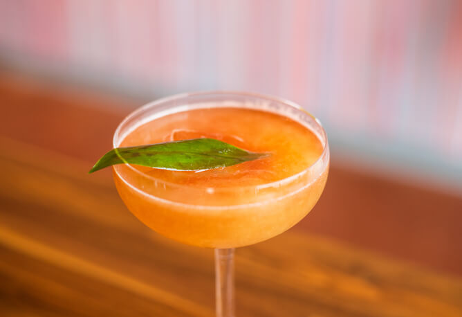 Orange iced cocktail from Bulrush STL restaurant