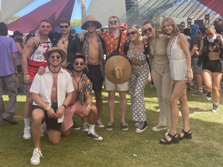 Friends pose for a picture outside of the Do-Lab stage at Coachella Music and Arts Festival