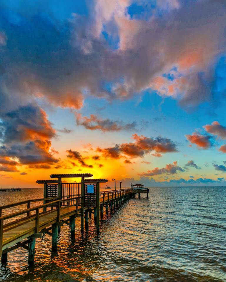 Sunset over the dock of Gulf Coast