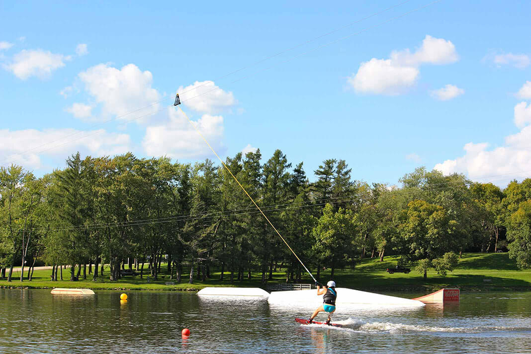 Wake boarder on the cable system at West Rock Wake Park on Levings Lake in Rockford, IL.